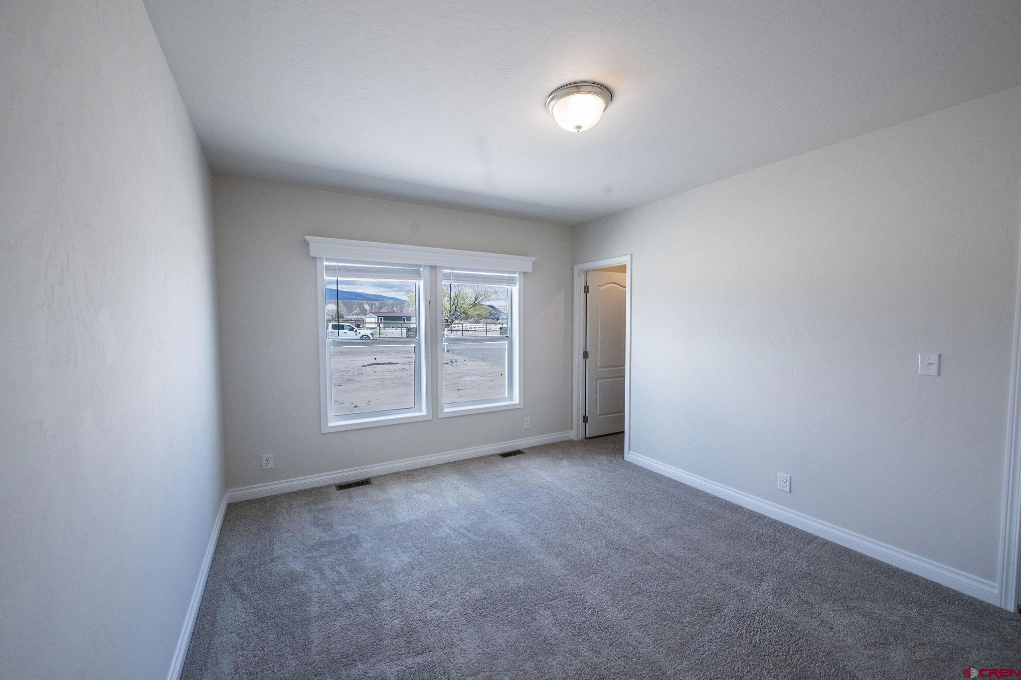 1246 H25 Road Delta, CO 81416 - Photo 7 of 31 an empty room with windows