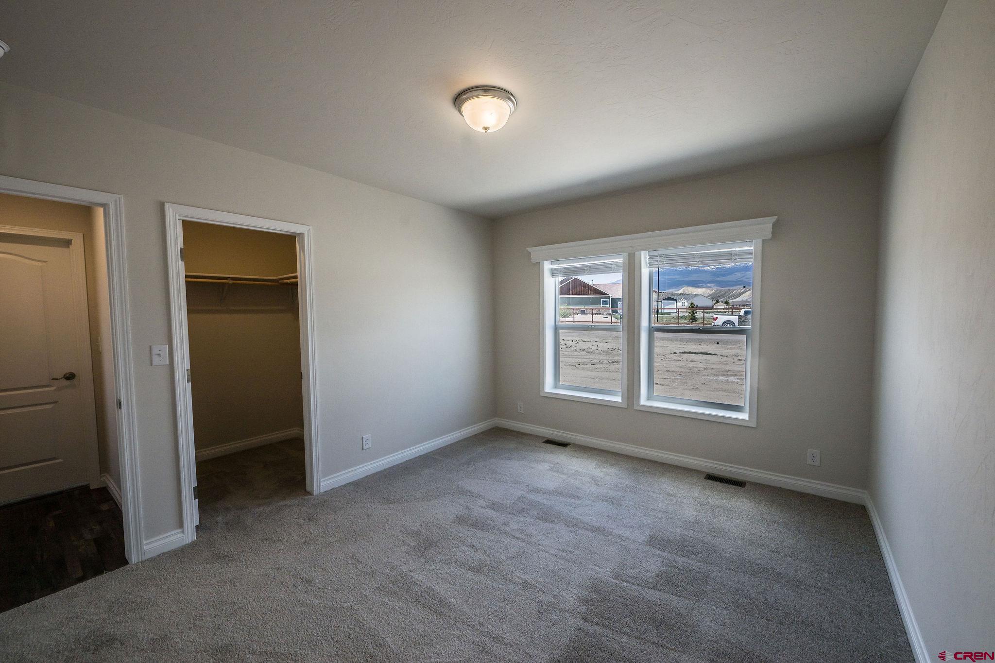 1246 H25 Road Delta, CO 81416 - Photo 9 of 31 an empty room with a window