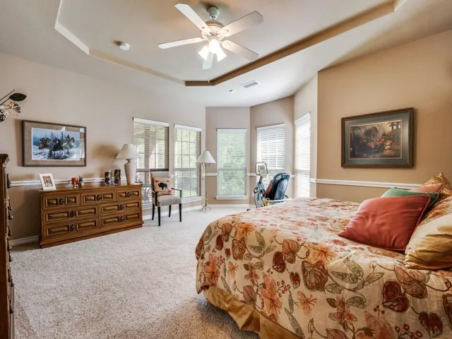 a bed room with a bed and dresser