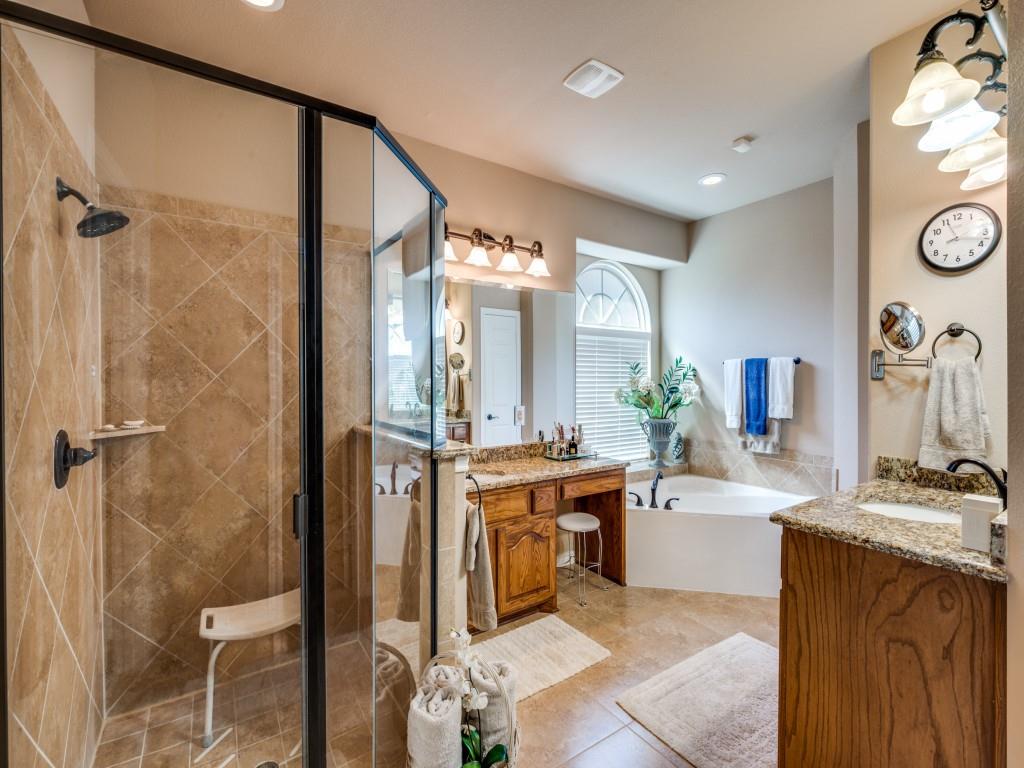 8305 Bishop Pine Road Denton, TX 76208 - Photo 17 of 27 a bathroom with a tub sink and mirror