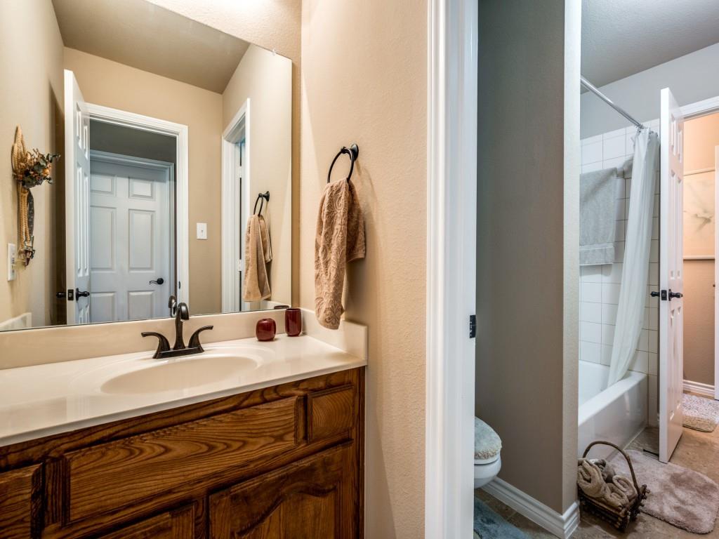 8305 Bishop Pine Road Denton, TX 76208 - Photo 22 of 27 a bathroom with a sink and a mirror