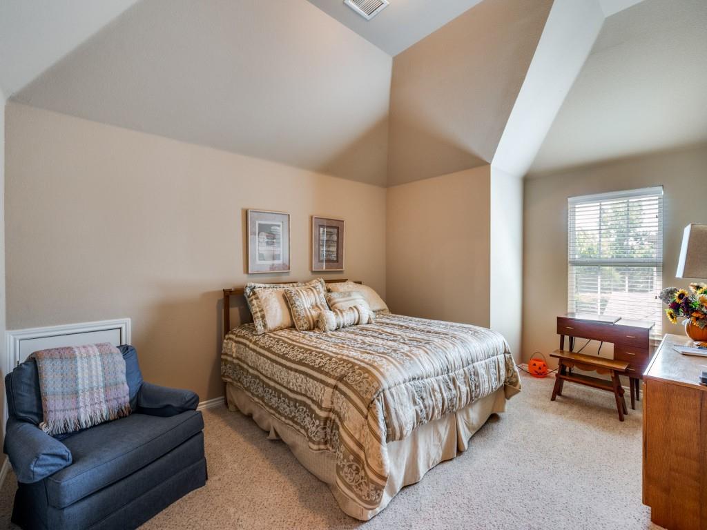 8305 Bishop Pine Road Denton, TX 76208 - Photo 23 of 27 a bedroom with a bed and a couch