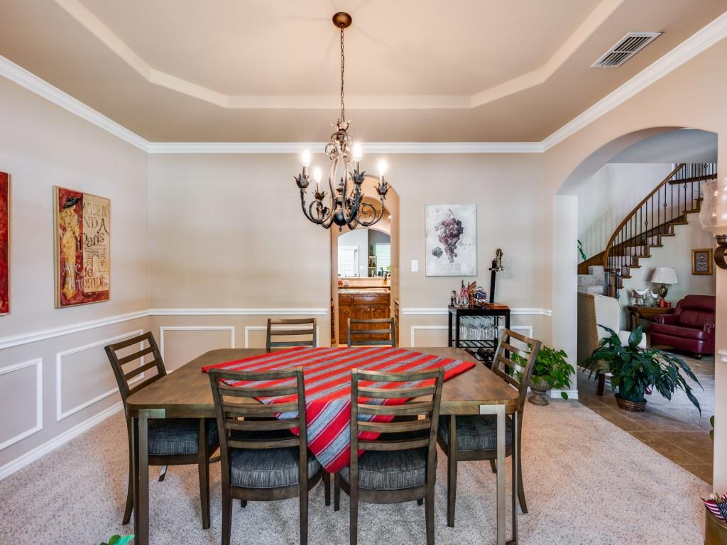 8305 Bishop Pine Road Denton, TX 76208 - Photo 5 of 27 a view of a dining room with furniture and chandelier