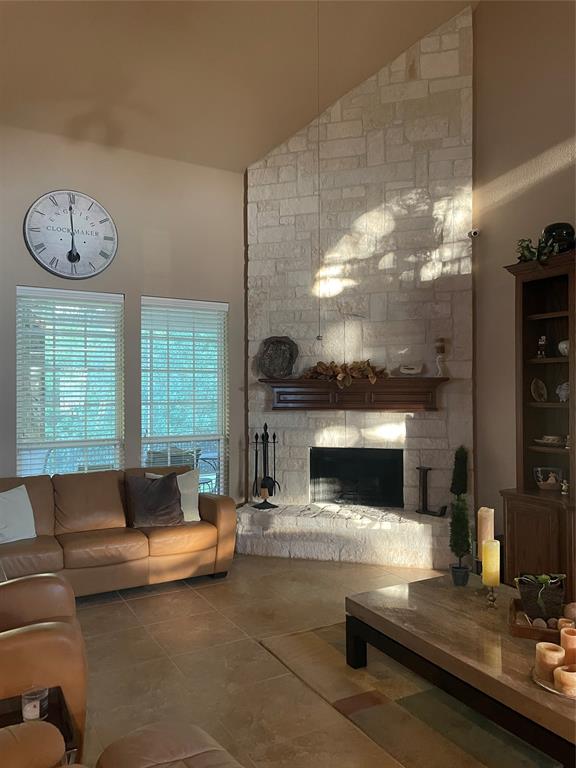 8305 Bishop Pine Road Denton, TX 76208 - Photo 9 of 27 a living room with furniture and a fireplace