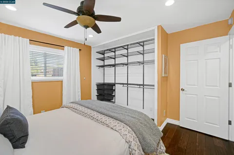 a kitchen with a white cabinets and white appliances