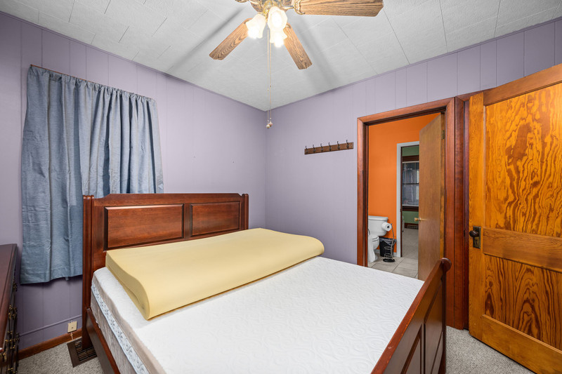 204 Adams Place Clinton, IA 52732 - Photo 19 of 20 a bedroom with a bed and a window