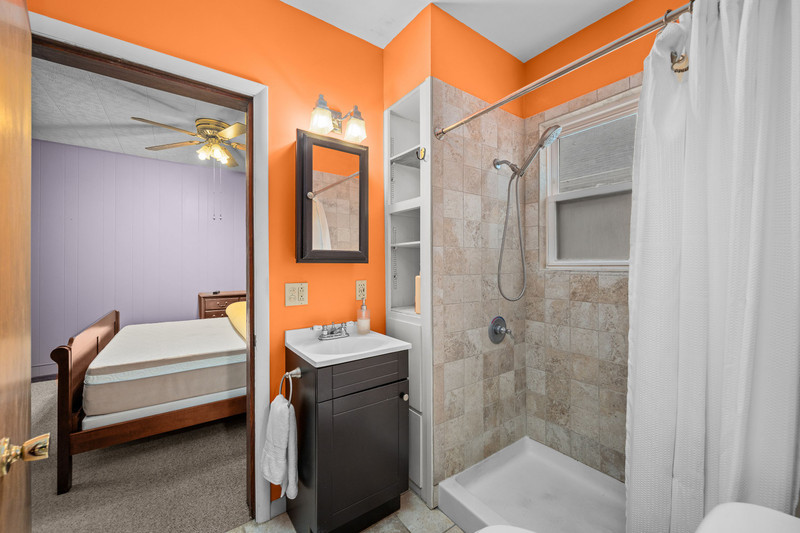 204 Adams Place Clinton, IA 52732 - Photo 20 of 20 a bathroom with a sink a toilet and shower