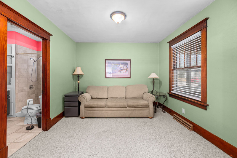 204 Adams Place Clinton, IA 52732 - Photo 8 of 20 a living room with furniture and a window