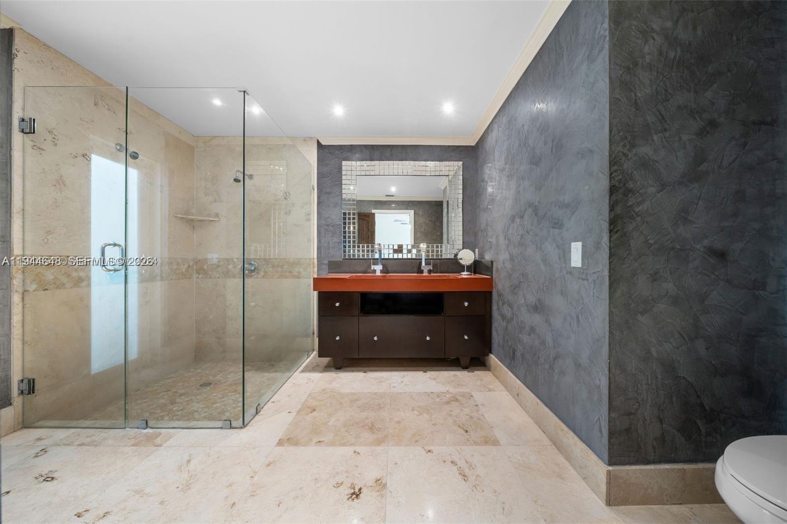 6411 Southwest 185th Way Southwest Ranches, FL 33332 - Photo 22 of 32 a bathroom with a sink a toilet and shower