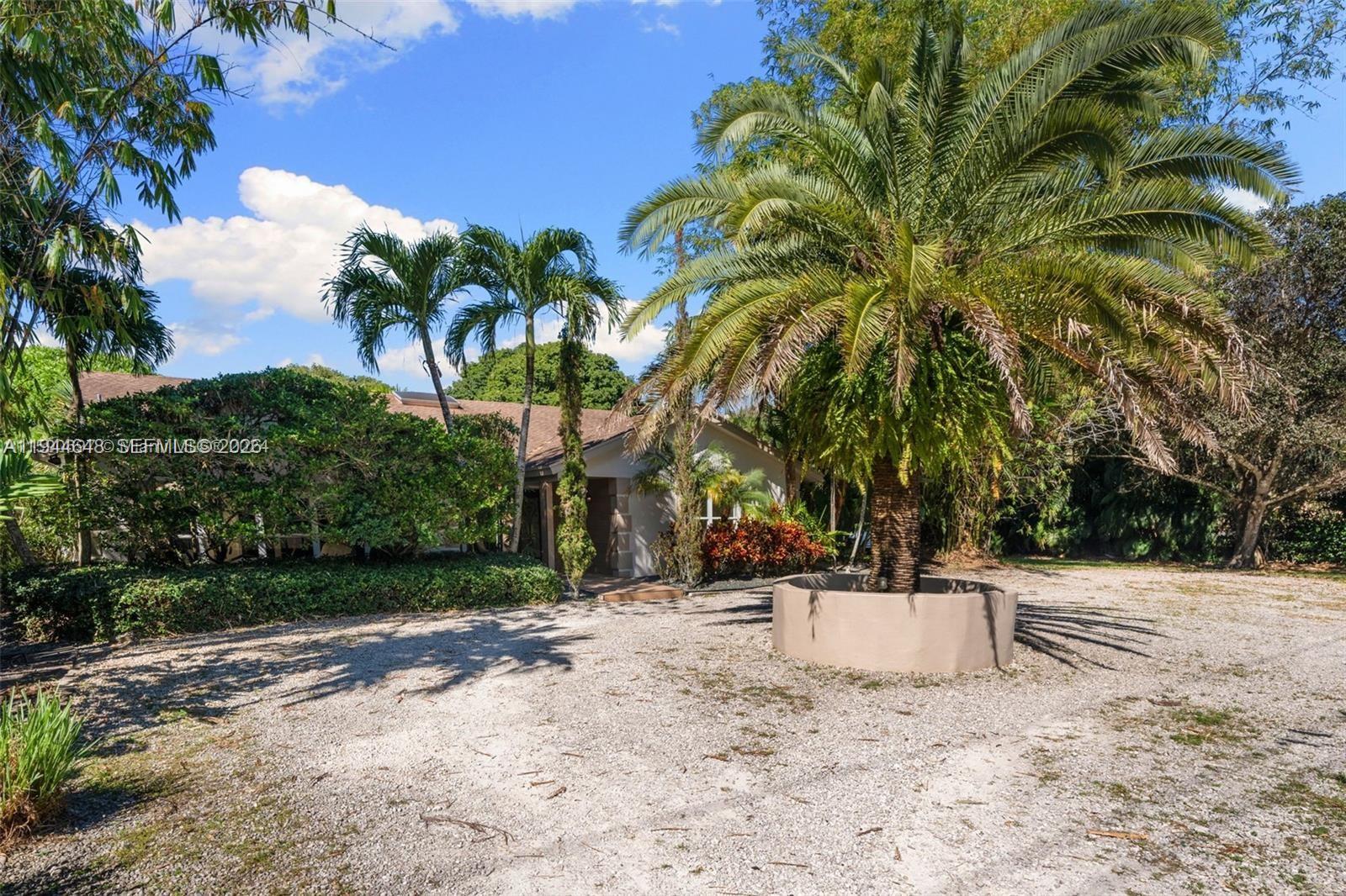 6411 Southwest 185th Way Southwest Ranches, FL 33332 - Photo 29 of 32 a view of a yard with a tree