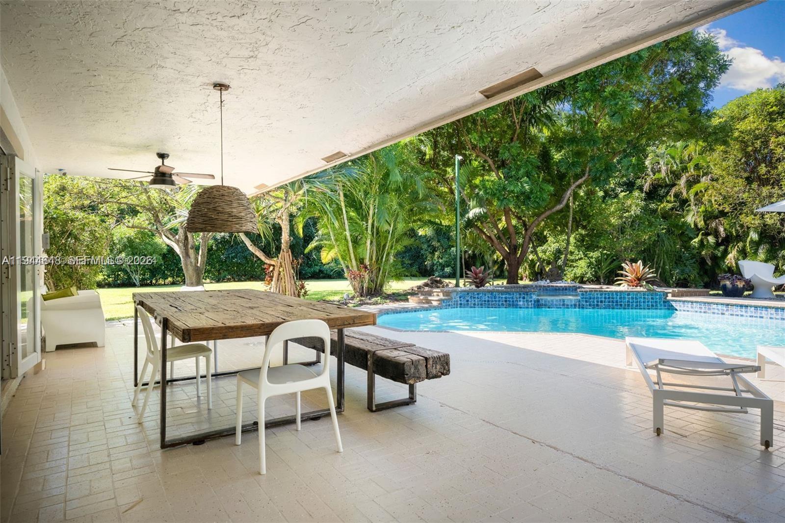 6411 Southwest 185th Way Southwest Ranches, FL 33332 - Photo 31 of 32 a view of a patio with table and chairs and potted plants
