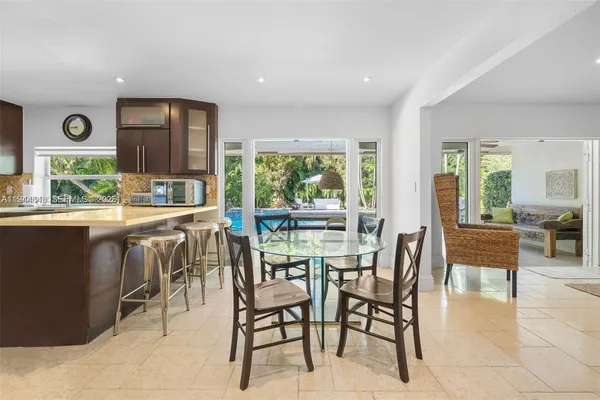 a dining room with furniture and window