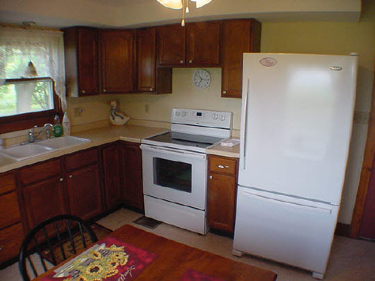 355 Porter Road Harmon, IL 61042 - Photo 3 of 11 a kitchen with a white stove top oven and sink
