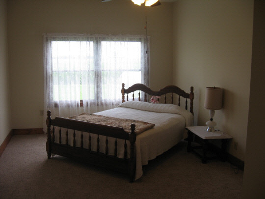 355 Porter Road Harmon, IL 61042 - Photo 5 of 11 a bed sitting in a bedroom next to a window