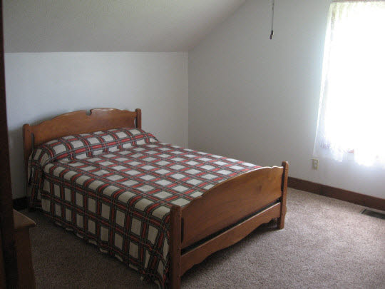 355 Porter Road Harmon, IL 61042 - Photo 6 of 11 a bed sitting in a bedroom next to a window