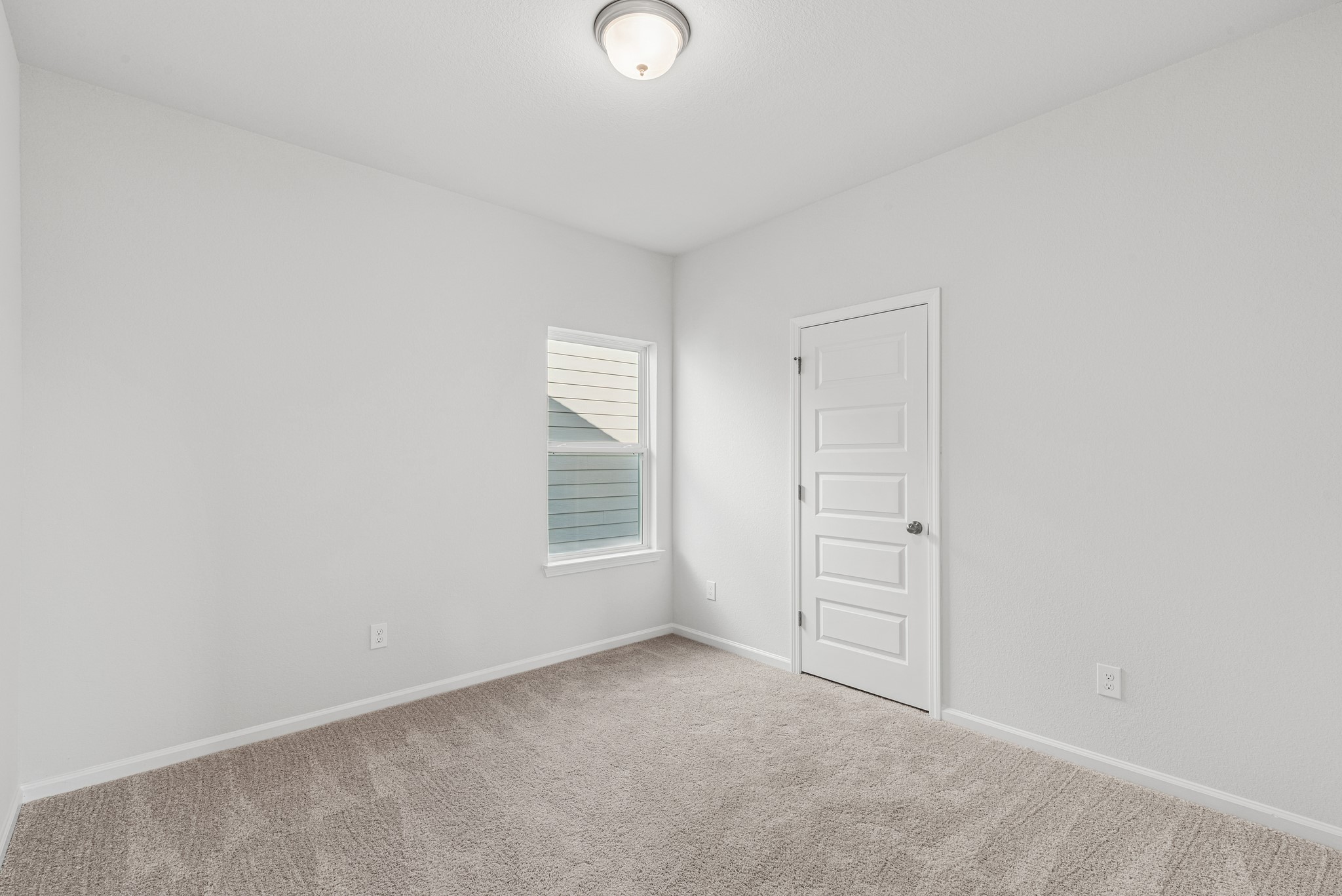 9745 Enclave Ridge Road Willis, TX 77318 - Photo 18 of 27 an empty room with windows and closet