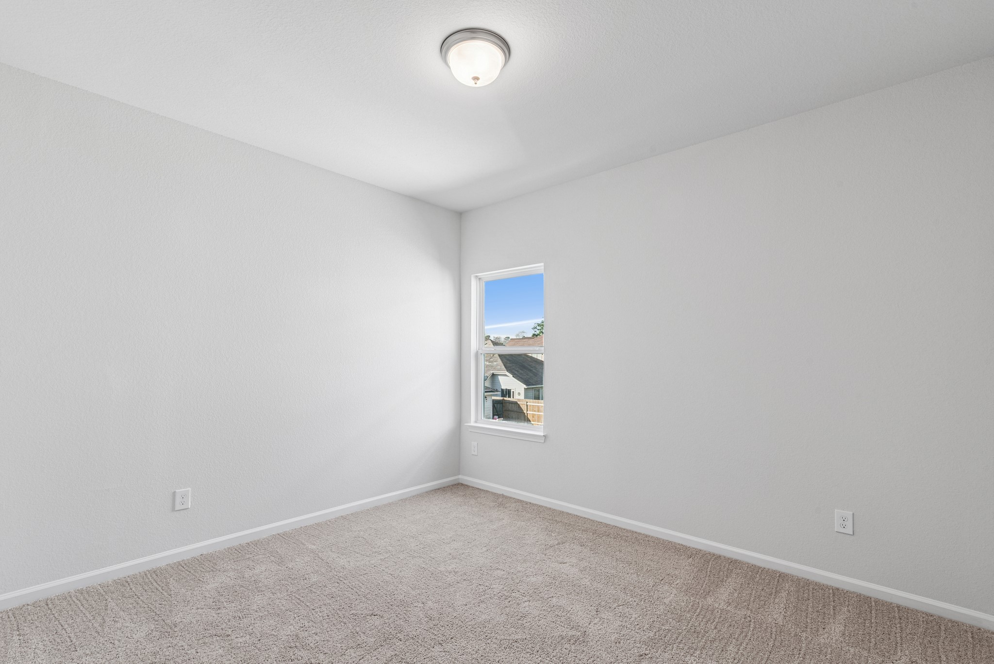 9745 Enclave Ridge Road Willis, TX 77318 - Photo 22 of 27 an empty room with windows