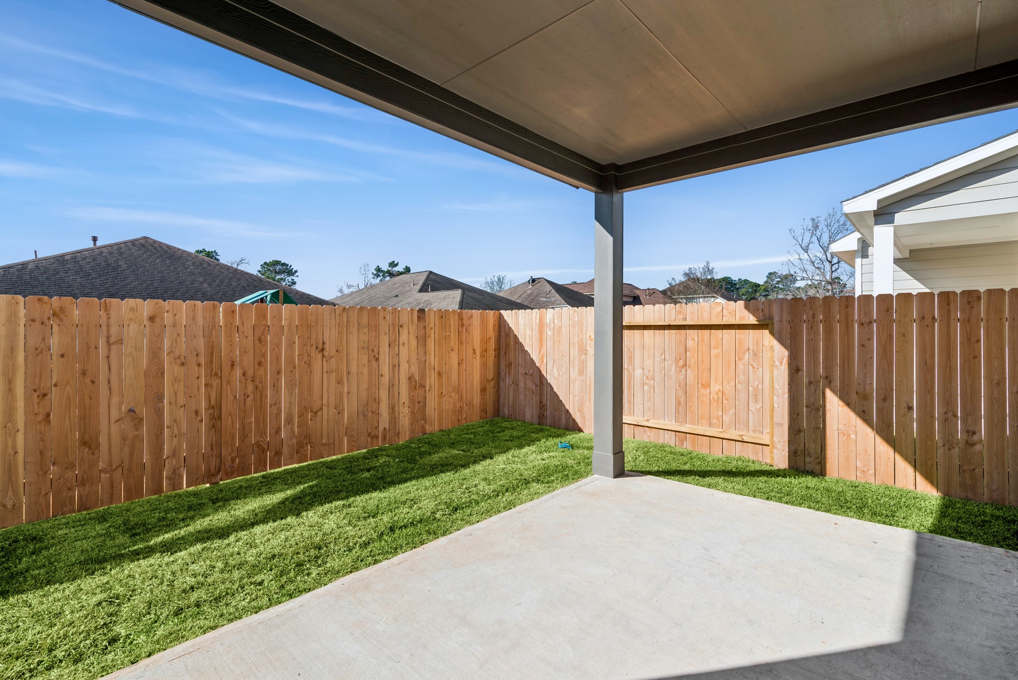 9745 Enclave Ridge Road Willis, TX 77318 - Photo 24 of 27 a view of backyard with tub and a garden
