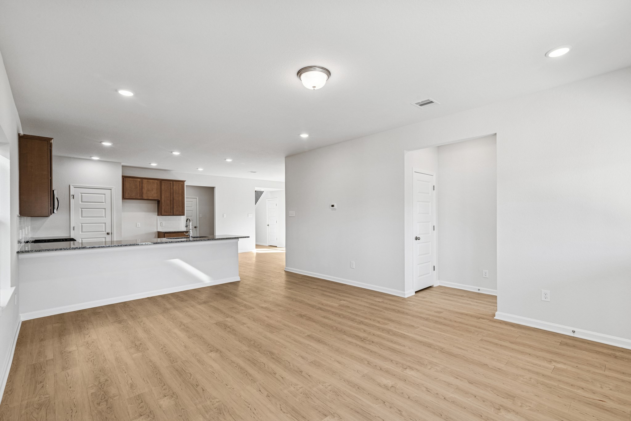 9745 Enclave Ridge Road Willis, TX 77318 - Photo 10 of 27 a view of a kitchen with a sink and a stove top oven