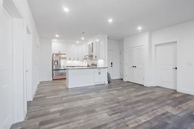 a view of kitchen with wooden floor