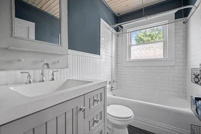 a bathroom with a sink a toilet and a bathtub