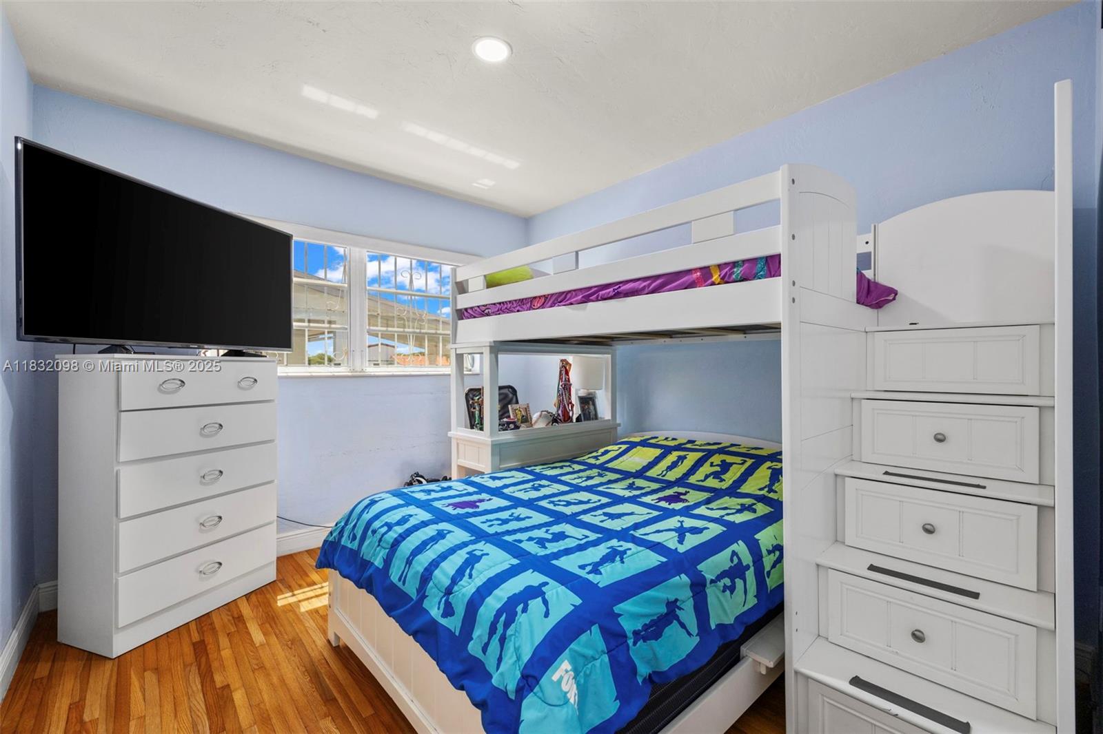 8631 Southwest 16th Terrace Miami, FL 33155 - Photo 20 of 61 a bedroom with a bed and flat screen tv