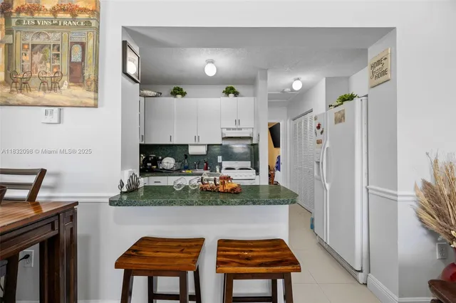 a view of a white house with wooden floor