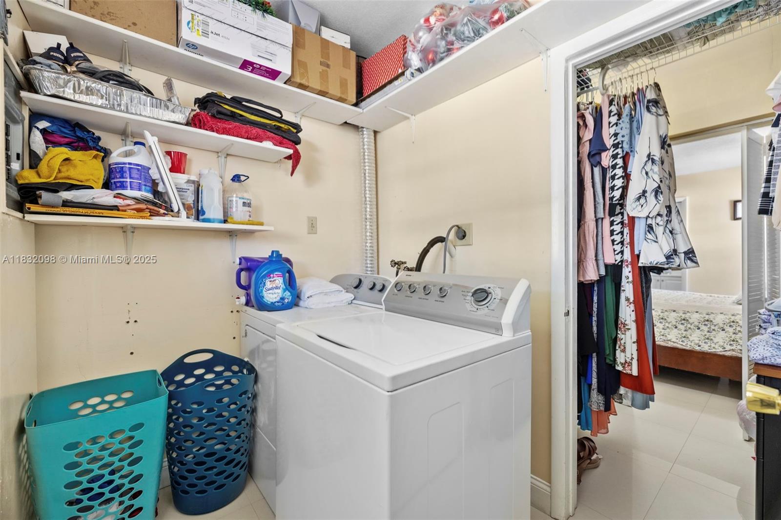 8631 Southwest 16th Terrace Miami, FL 33155 - Photo 39 of 61 a utility room with fridge dryer and washer