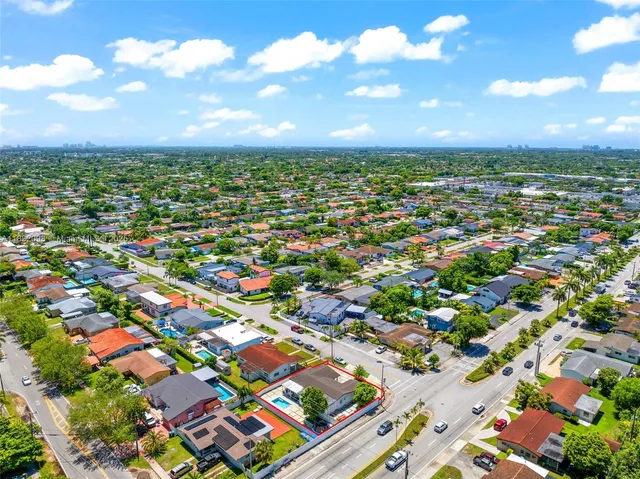 a view of a swimming pool with outdoor seating