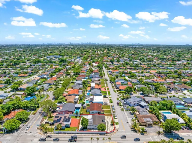 a living room with furniture and a clock