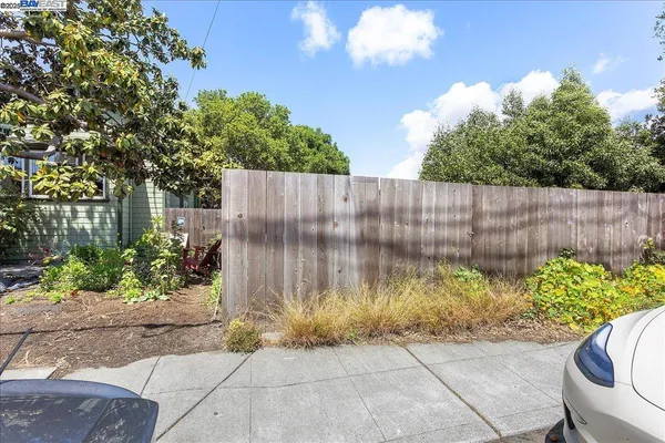 a garden view with iron fence