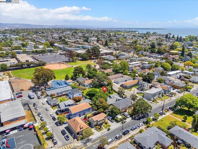 an aerial view of residential houses with outdoor space