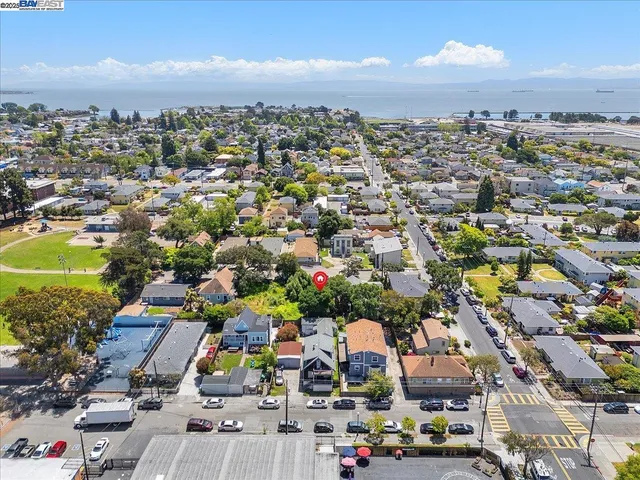 an aerial view of residential houses with city view