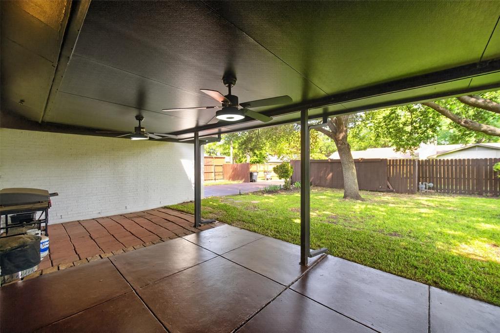 3919 Ridgeoak Way Farmers Branch, TX 75244 - Photo 25 of 28 Covered patio with concrete flooring, accented by a brick paver section