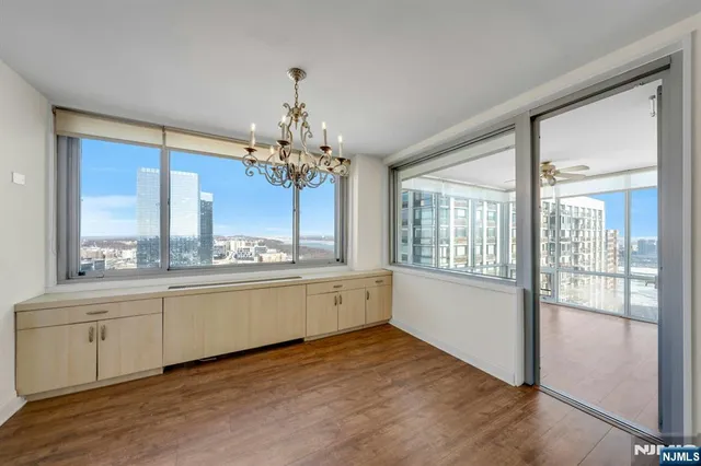 a bedroom with a bed and a view of kitchen