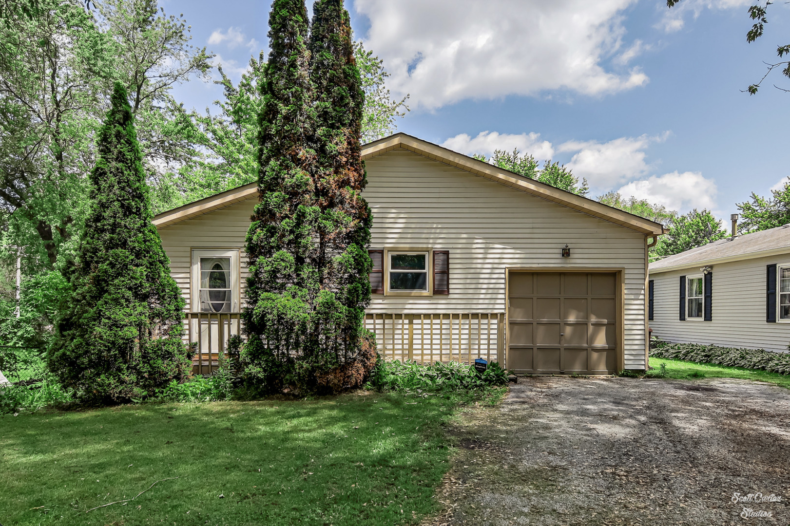 304 South Lily Lake Road McHenry, IL 60051 - Photo 1 of 12 a view of house with a yard and large tree