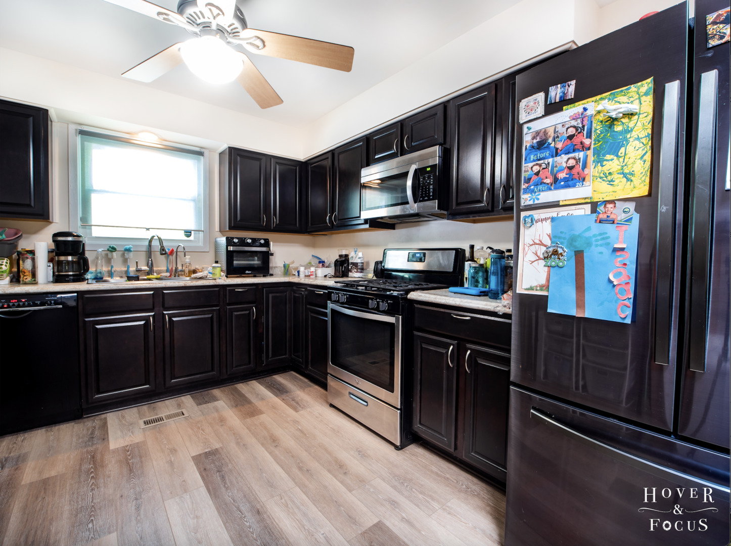 304 South Lily Lake Road McHenry, IL 60051 - Photo 5 of 12 a kitchen with stainless steel appliances granite countertop a refrigerator and a sink