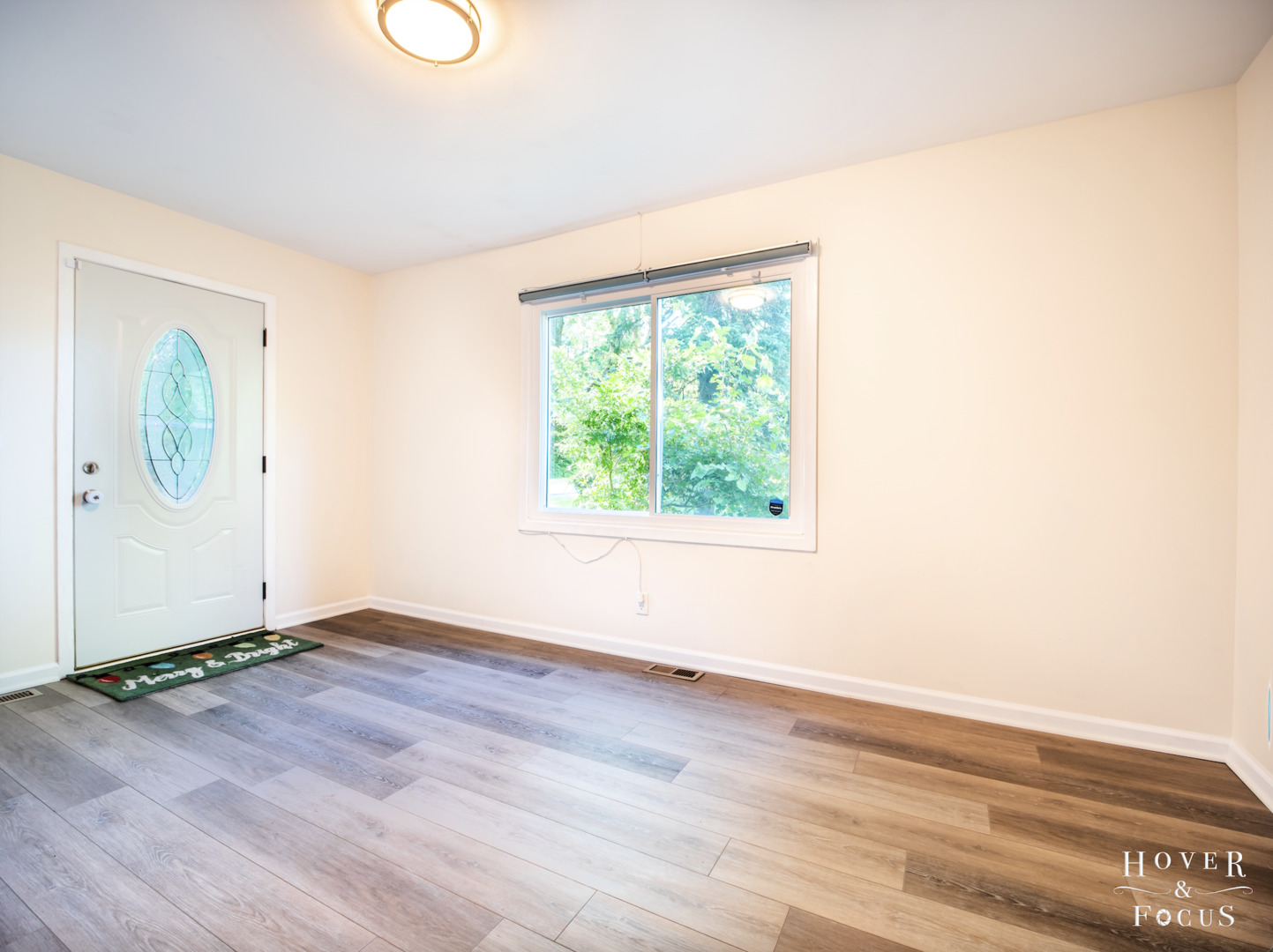 304 South Lily Lake Road McHenry, IL 60051 - Photo 6 of 12 an empty room with wooden floor and windows