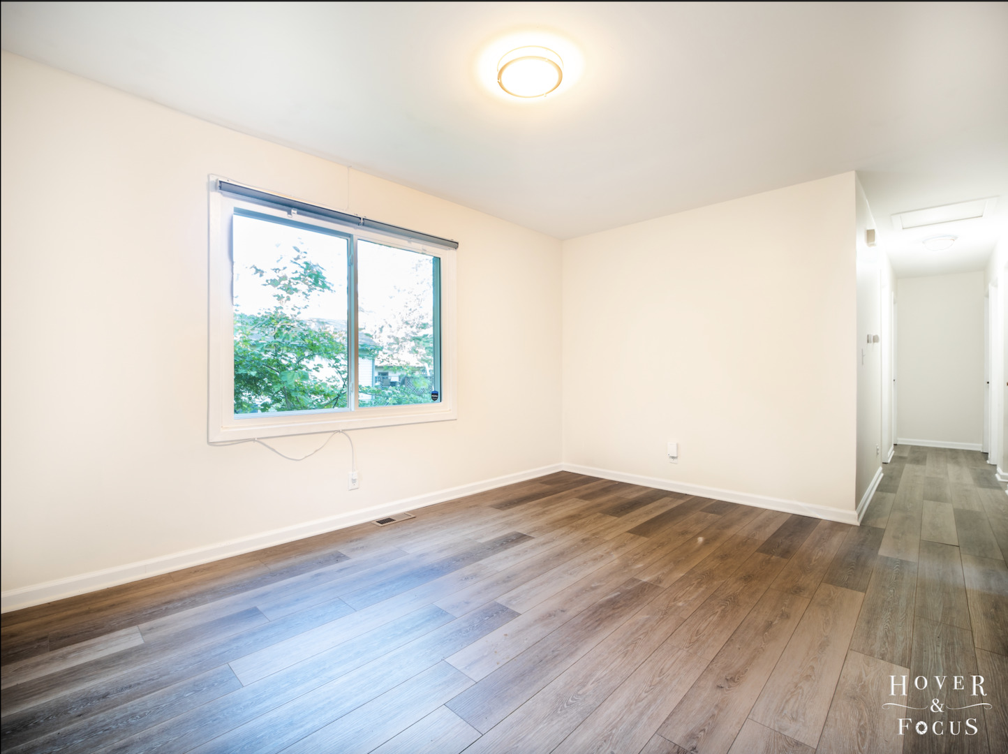 304 South Lily Lake Road McHenry, IL 60051 - Photo 7 of 12 an empty room with wooden floor and windows