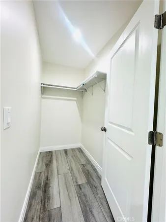a view of a room with wooden floor and small staircase