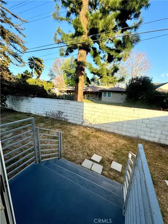 a view of a house with wooden floor and a outdoor space
