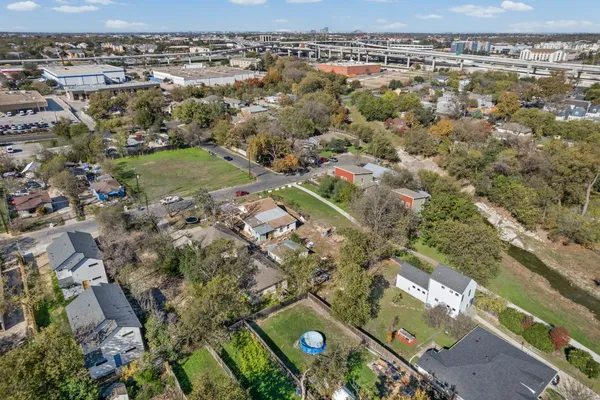 an aerial view of residential houses with outdoor space