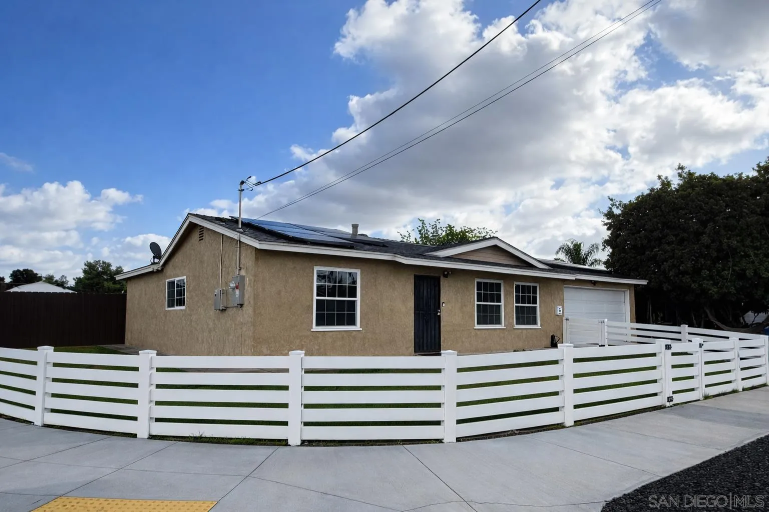 557 Parkbrook Street Spring Valley, CA 91977 - Photo 2 of 8 a view of a white house with a roof deck