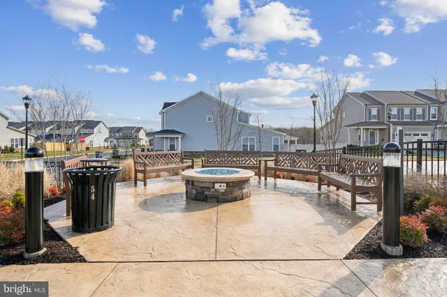 a view of a house with backyard porch and sitting area
