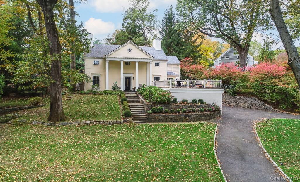 Welcome to 94 Round Hill Road in Old Edgemont-- Beautifully positioned behind a long circular driveway and nestled in the heart of Old Edgemont and within short walking distance to Edgemont Junior-Senior High School, scenic Crane's Pond, and the Scarsdale Train Station!