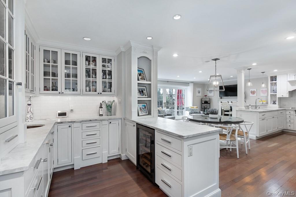 94 Round Hill Road Scarsdale, NY 10583 - Photo 11 of 46 View of the butler's pantry with wet bar opens to the eat-in chef's kitchen with breakfast area and family room.
