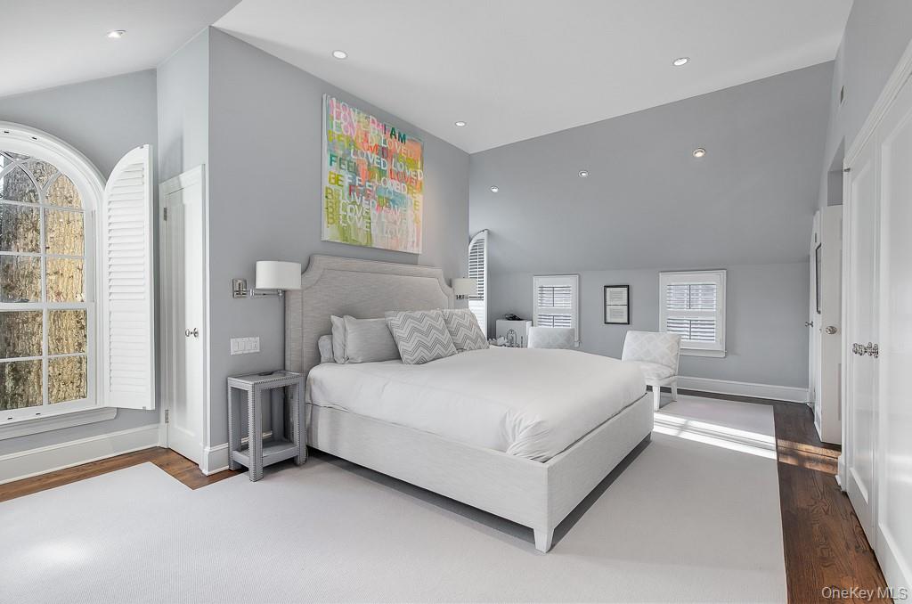 94 Round Hill Road Scarsdale, NY 10583 - Photo 22 of 46 5 Bedrooms on the 2nd level include a luxurious primary bedroom suite offers a high cathedral/tray ceiling, oversized windows with custom shutters, and multiple custom-fitted closets.