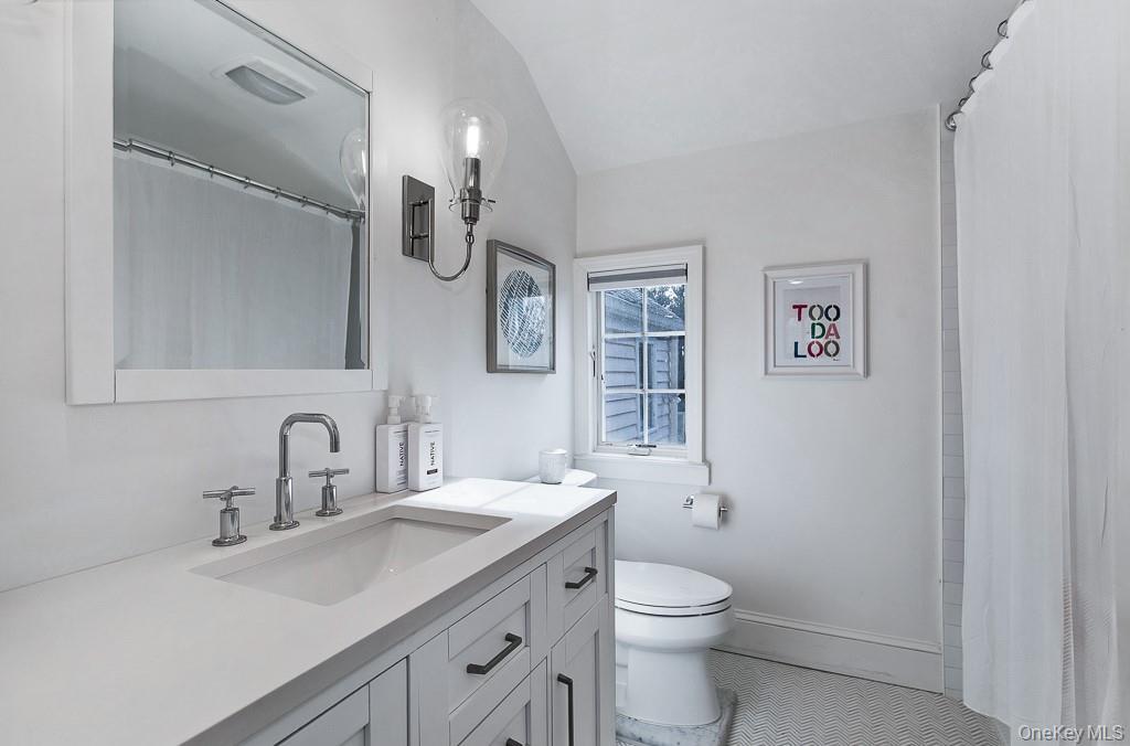 94 Round Hill Road Scarsdale, NY 10583 - Photo 26 of 46 The modern and renovated full hallway bathroom on the second level serves three of the five bedrooms.