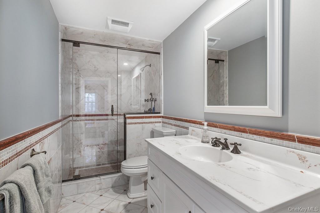 94 Round Hill Road Scarsdale, NY 10583 - Photo 34 of 46 View of the full ensuite bathroom on the lower level.
