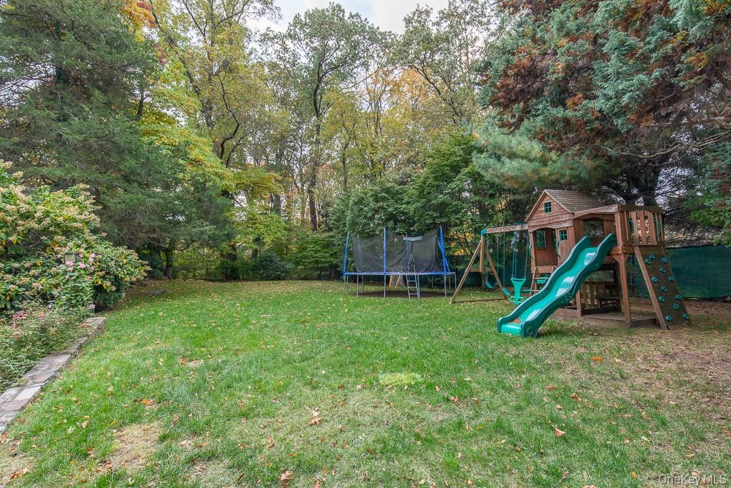 94 Round Hill Road Scarsdale, NY 10583 - Photo 35 of 46 Private backyard offers room for a pool and ample space for outdoor enjoyment.